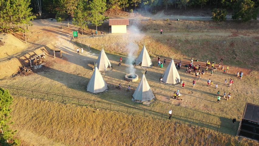 Indians tent at rural landscape. Pocos de Caldas, Minas Gerais, Brazil. Indian tent. Indian life at brazilian forest trees. Pocos de Caldas, Minas Gerais, Brazil. Indians villa. Indians village tent.