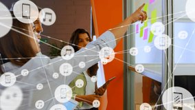 Network of digital icons against diverse office colleagues discussing over memo notes at office. global networking and business technology concept - Powered by Shutterstock - Get 15% off with code: PIKWIZARD15