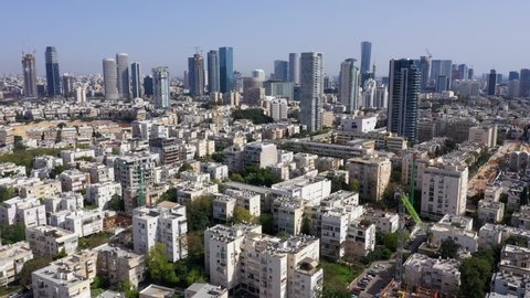 Tel Aviv skyline over Kikar Hamedina square with business district skyscrapers in the horizon, Aerial view.
