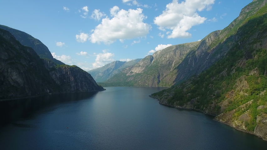 Big fjord between huge mountains Royalty-Free Stock Footage #1077986645