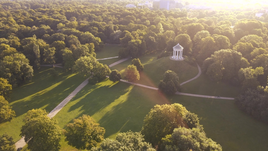 Monopteros in English Garden  Replica Greek temple with garden views build in 19th century in Munich central Park  Aerial drone shot during summer Royalty-Free Stock Footage #1077988382
