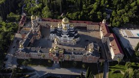 Aerial video from the drone. Incredibly beautiful monastery with golden domes in the city of Akhali Atoni, Abkhazia.