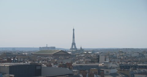 Panoramic View Of Paris, France, With The Eiffel Tower And Many City Rooftops At Daytime - wide shot