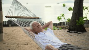 Asian elder senior man relax at sand beach tropical dream retirement life - Powered by Shutterstock - Get 15% off with code: PIKWIZARD15