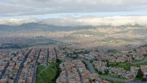 Aerial view Bogota Colombia. Panoramic city view. Cityscape with various districts, slums, criminal drug districts and a city on the slopes of the mountains.