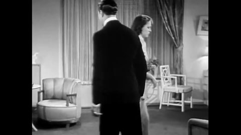 CIRCA 1937 - In this comedy movie, a man threatens to spank his girlfriend for being disagreeable.