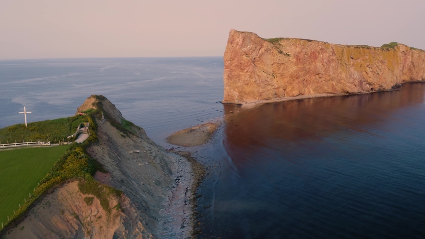 Aerial view of the Rocher Percé in the city of Percé in Quebec, Canada, at sunset, from drone