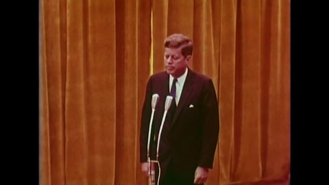 CIRCA 1960s - President Charles de Gaulle gives a speech on stage welcoming president Kennedy who pays his respect to Europe in 1961.