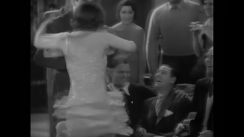 CIRCA 1929 - In this musical, a flapper dances with a man at a college party.