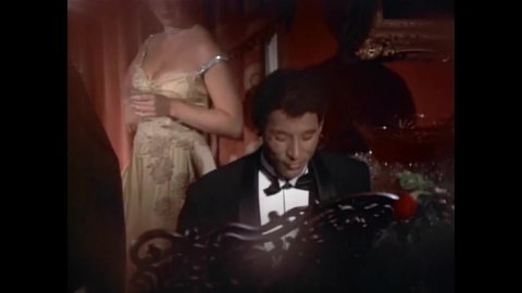CIRCA 1978 - In this period piece, a man plays the piano while men dance with prostitutes at a New Orleans dance hall.