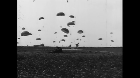 CIRCA 1954 - On D-Day, American soldiers storm the beaches of Normandy while the 101st Airborne Division drops paratroopers.