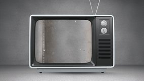 Animation of retro television set with distressed vintage analogue film on screen. vintage media and communication concept digitally generated video.