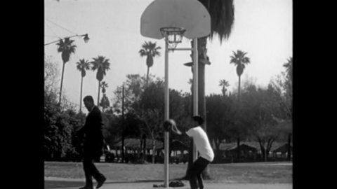 CIRCA 1961 - A gay man plays basketball with a lonely teenager and gains his trust with praise, which the narrator describes as misplaced.