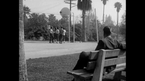 CIRCA 1961 - A gay man watches teen boys play basketball in the park, then offers to give a ride home to one who is staying late to practice.