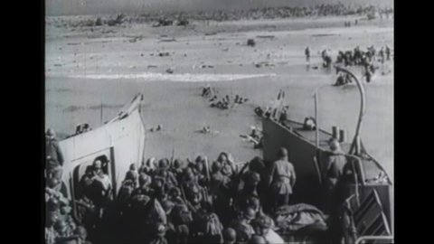 CIRCA 1944 - American troops land at Omaha Beach on D-Day in Normandy, France.