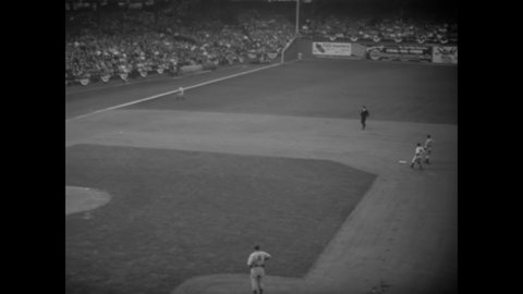 CIRCA 1941 - Charley Stanceu pitches in a baseball game at Ebbets Field between the Brooklyn Dodgers and the New York Yankees.