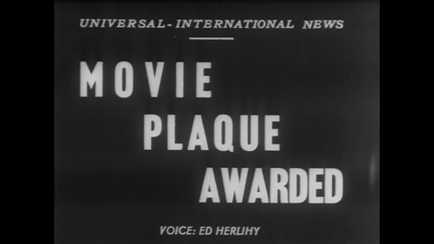 CIRCA 1952 - A production executive of Universal Studios wins Look Magazine's film Achievement Award.