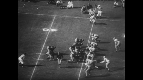 CIRCA 1949 - The USC Trojans defeat the US Navy Midshipmen in football at the Coliseum in Los Angeles, California.