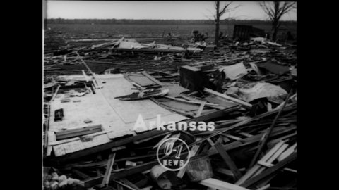 CIRCA 1949 - People try to salvage what they can after a devastating tornado in Warren, Arkansas.