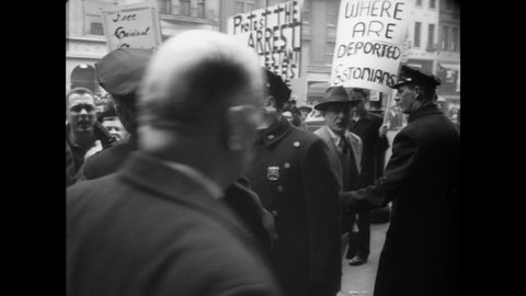 CIRCA 1949 - Anti-communist protestors picket outside Carnegie Hall, where the Cultural and Scientific Conference for World Peace is held.