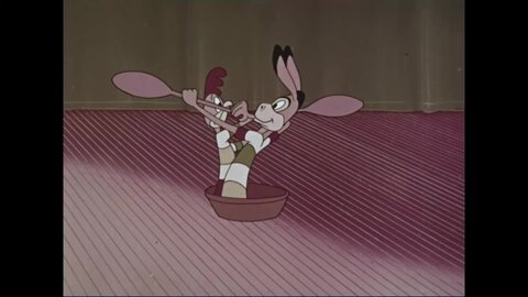 CIRCA 1962 - In this animated film, a donkey and rooster dance on stage on banana peels to "the man on the flying trapeze."