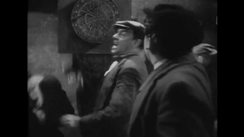 CIRCA 1937 - In this comedy movie, men in an Irish pub get into a fist fight about who has the best hometown.