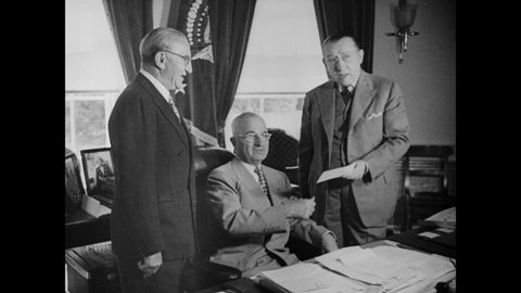 CIRCA 1945 - President Truman receives donations from March of Dime organizers at the White House, who collected funds from filmgoers.
