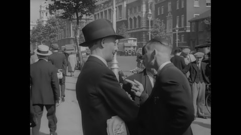 CIRCA 1940 - British civilians discuss the news on the sidewalks of London, and see headlines about Czechoslovakia.