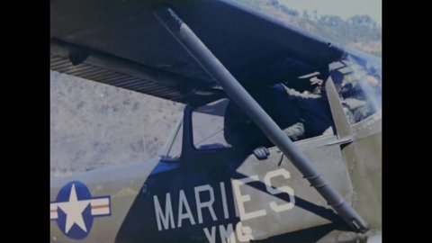 CIRCA 1951 - Actor Danny Kaye and singer Monica Lewis disembark from a small aircraft at a US Marines base in Korea.