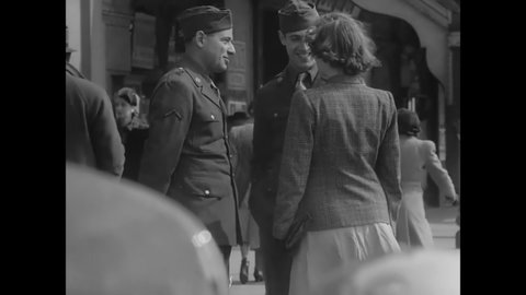 CIRCA 1940s - British soldiers and civilian women patronize boardwalk shops and food stands.