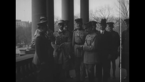 CIRCA 1918 - General PC Harris is decorated by French and Italian military officers outside the State Building in Washington DC.