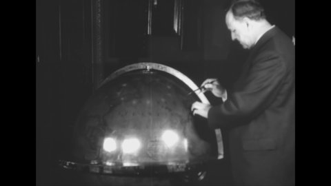 CIRCA 1918 - Secretary Daniels strolls through a Washington DC park with his wife, then looks over a large globe in his office at the Navy Department.