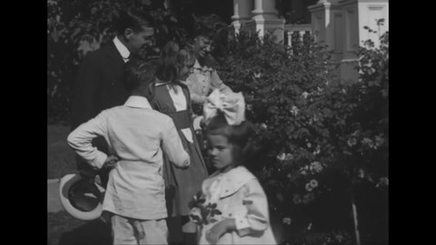 CIRCA 1918 - Secretary Baker and his wife tend to their Washington DC garden with their children, then leave to make a social call.