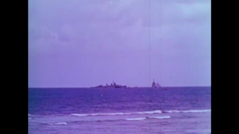 CIRCA 1950s - An atomic bomb is detonated underwater at Bikini Atoll, near some ships.