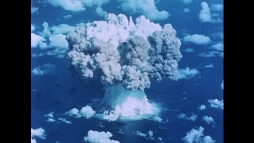 CIRCA 1950s - An atomic bomb is detonated at Bikini Atoll, leading to an enormous mushroom cloud.