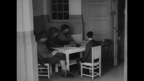 CIRCA 1945 - Nazi doctors Adolf Wahlmann and Karl Willig are interrogated by American soldiers about their genocidal work at Hadamar.