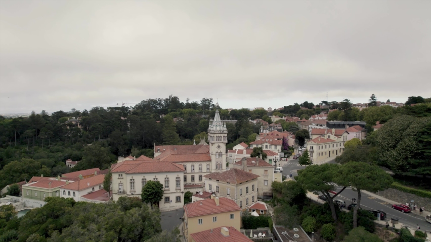 Aerial panning shot of historic city town hall, Câmara Municipal de Sintra with decorative tower.