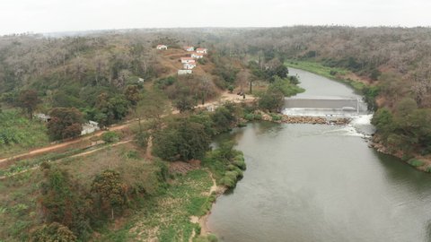 Traveling down over a river, dam on a river in Angola, Africa