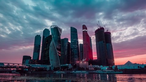 Moscow, Russia, August 20, 2021 Day to night urban time lapse of Moscow-city downtown business center with tall buildings. Cityscape of illuminated city.