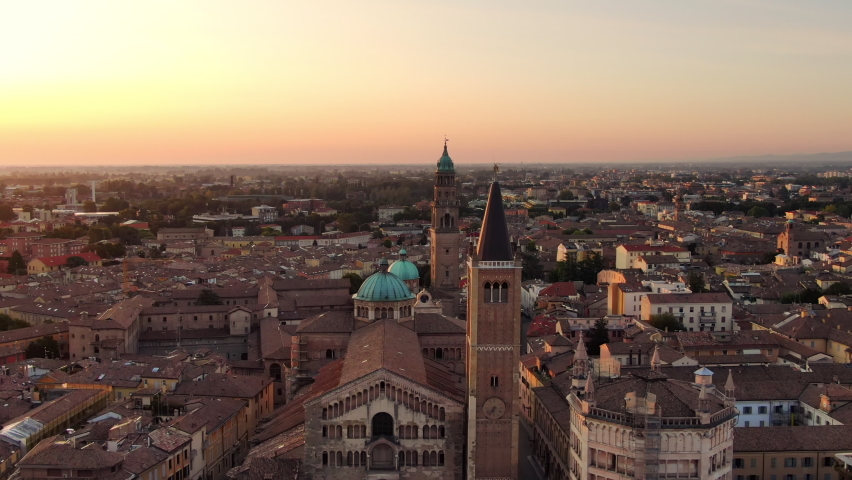 aerial view drone of parma city centre cathedral baptistery at sunrise,italian town skyline cityscape at dawn