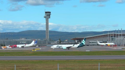 Oslo Airport Norway - August 20 2021: airplane new airline flyr boeing 737 taxiing distant control tower