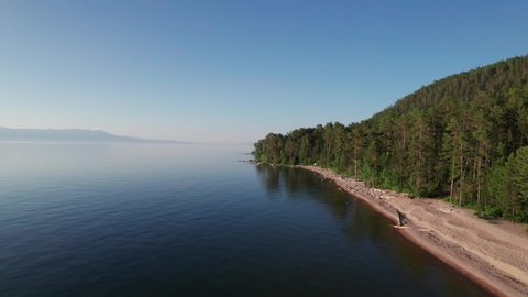 Summer evening aerial landscape of Lake Baikal is a rift lake located in southern Siberia, Russia Baikal lake summer landscape view. Drone's Eye View.