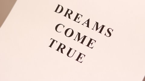 Dreams Come True phrase printed on the sheet paper.