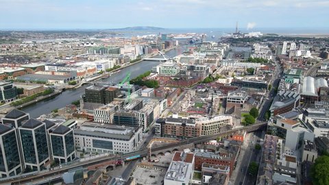 Aerial view over Dublin City Centre in Republic of Ireland. The drone is flying near the Dublin port on a bright sunny day.