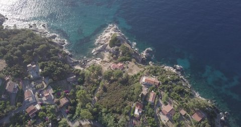 Aerial drone view top down coastline, beaches and houses of the island Isola d'Elba, Italy close to Sant Andrea