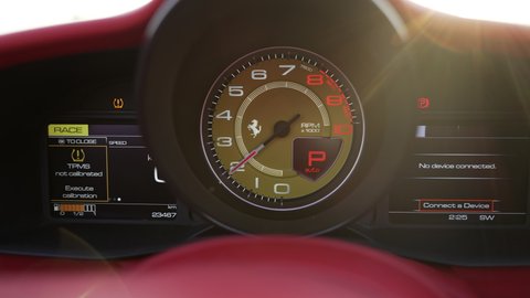 dashboard of a sports car. speedometer and tachometer close-up. ferrari spider . 2021.05.06