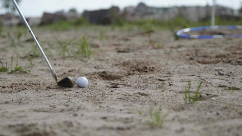 Golf club on the sand