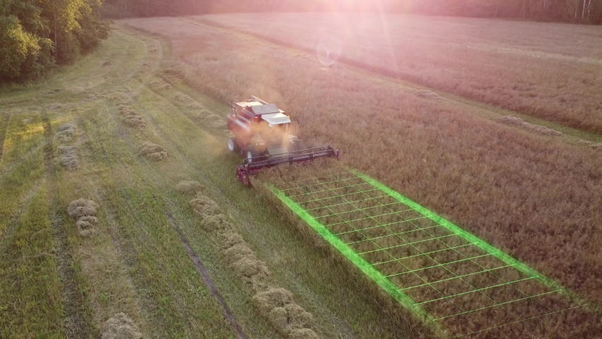 Autonomous self-driving combine harvester of the future with autopilot harvests grain field using GPS navigation system. Aerial view, animation with graphic HUD elements. Royalty-Free Stock Footage #1078066052