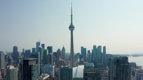 Toronto, Canada - 2021 08 20: Aerial Drone of Downtown Toronto CN Tower, Rogers Arena and Business District of Ontario's Capital City on Sunny Day