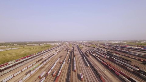 Aerial side pan over huge train depot